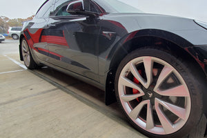 Tesla Model 3 with Rally Armor Mudflaps, 3/4 view